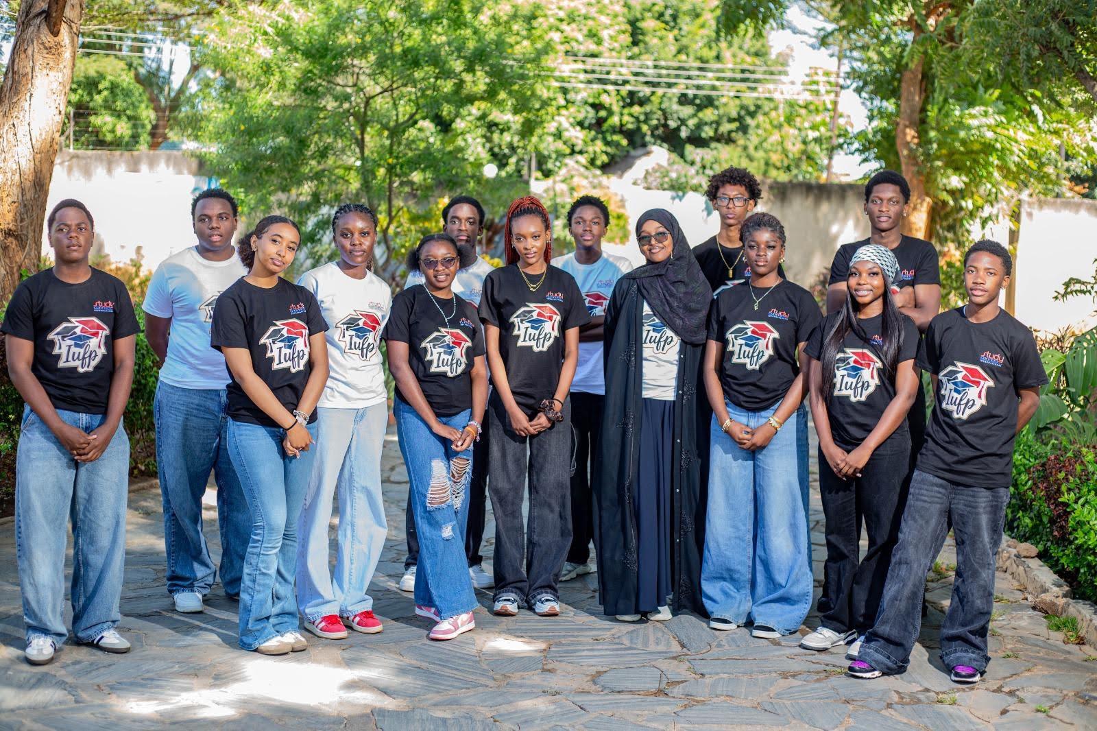 IUFP foundation programme students in branded IUFP t-shirts, standing together outdoors